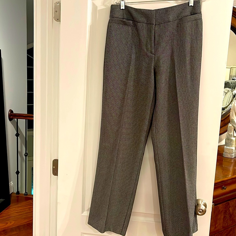 Black and white dress pants with button and zipper. Worn once Missing one button